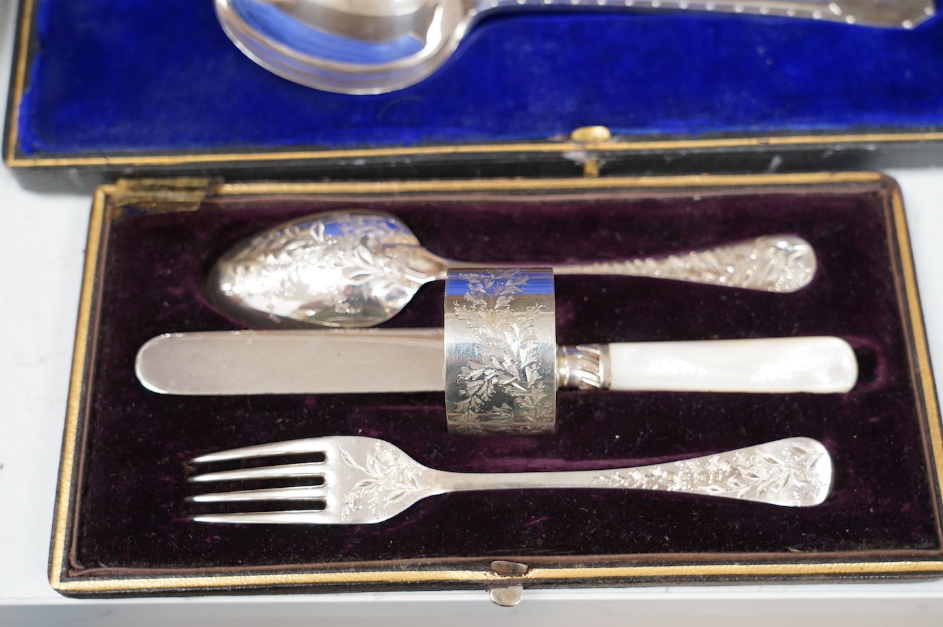 A cased set of six silver handled tea knives and six other cased plated sets. Condition - fair